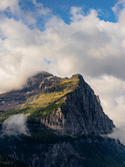 Fototapeta premium Cloudy Glacial Peak Amongst Clouds