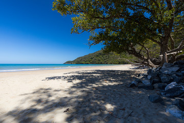 Deserted beach on summer day in tropical Queensland