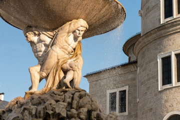 Salzburg, Salzburg / Austria - Baroque fountain called Residenz Fountain (Residenzbrunnen) in the center of Salzburg, on the list of UNESCO World Heritage. Made of limestone.