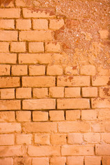 Old damage brick wall with colorful graffiti