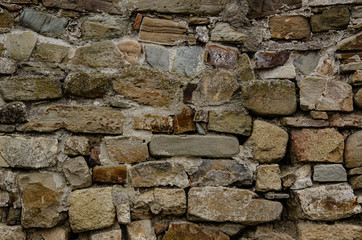 Background, texture, old masonry of the old fortress.