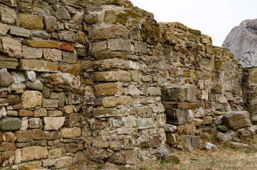 The wall of the old fortress, towers and structures, the ruins of the old fortress.