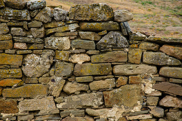 Background, texture, old masonry of the old fortress.