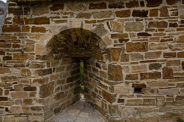 Embrasure, loophole in the wall of an old mountain fortress.