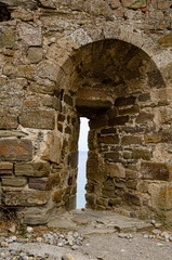 Embrasure, loophole in the wall of an old mountain fortress.