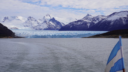 Perito Moreno Glacier and Argentina national flag