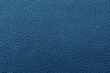 Blue artificial leather texture. Macro closeup abstract fashion background.