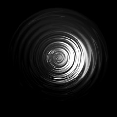 Light shining on white water ripple with black backdrop , abstract texture background
