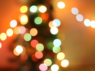 Christmas bokeh , Christmas tree with  colorful lights decoration in the dark room.