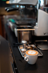 Hot coffee latte in white cup