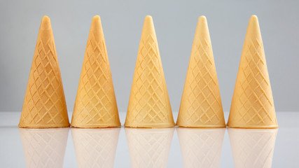 Empty waffle cups on a white background. Preparation for desserts and ice cream.