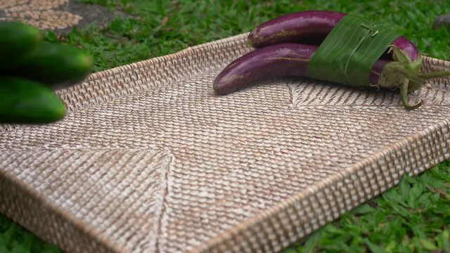 Eco-friendly product packaging concept. Vegetables wrapped in a banana leaf, as an alternative to a plastic bag. Zero waste concept. Alternative packaging