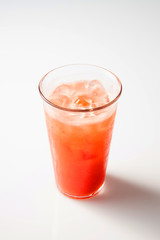 a watermelon juice with ice on a white background.