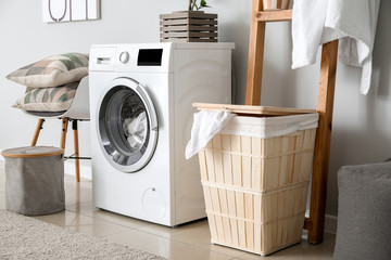 Interior of home laundry room with modern washing machine