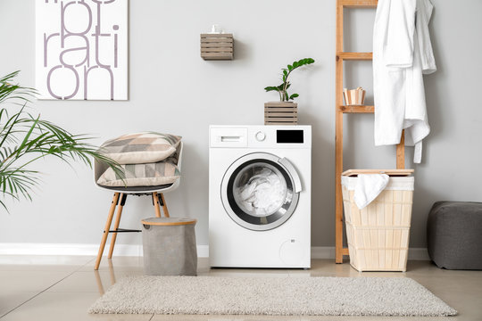 Interior Of Home Laundry Room With Modern Washing Machine