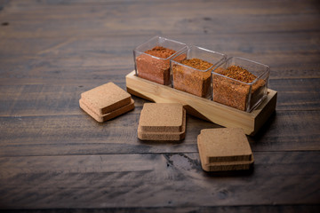 spices set on wooden table cumin and glass set