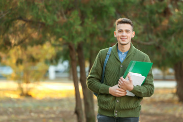 Portrait of teenage male student outdoors