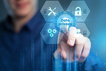 Business, Technology, Internet and network concept. Young businessman working on a virtual screen of the future and sees the inscription:Data privacy.