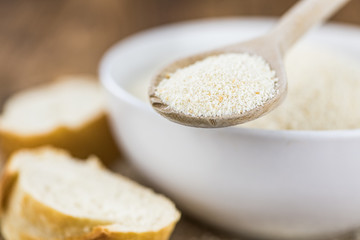 Vintage wooden table with Bread Crumbs (selective focus; close-up shot)