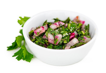 Some Homemade Chimichurri isolated on white (selective focus)