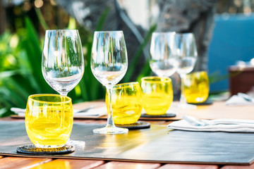 Wine glass with dining set prepare for breakfast lunch or dinner on table in restaurant