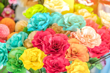Close up to beautiful decoration artificial flower or faked flowers for sale at local market. Selective focus
