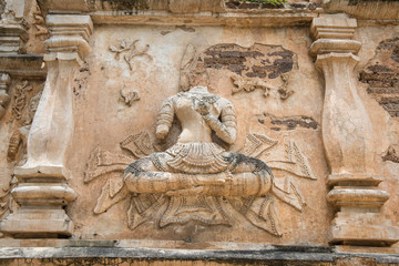 The ancient stucco figures decorated outside the wall of Viharn in Wat Jed Yod of Chiang Mai province of Thailand. This stucco reliefs is the most beautiful figures in traditional Lanna style. 