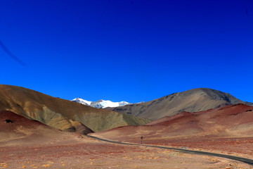 colorful mountains with a snow cap and blue sky, Ladakh, India