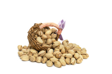 Closeup pistachios nut dry roasted and salted with basket weave isolated on white background