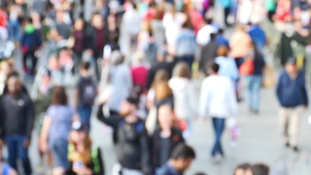 People Walking and Driving in the Busy City Streets in London, England UK (camera lens defocus).