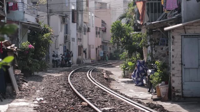Nha Trang, Kh&aacute;nh H&ograve;a / Vietnam - 10.06.2019 passengers walk on the platform of the railway station in Vietnam, get into the car, inspect the train and wait