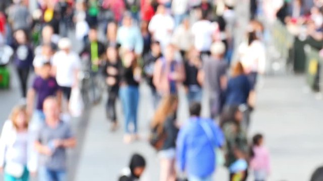 People Walking and Driving in the Busy City Streets in London, England UK (camera lens defocus).