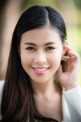 portrait close up young Asian woman with smiley face