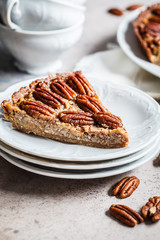 Pecan Pie on gray-brown background. Vegan dessert concept.
