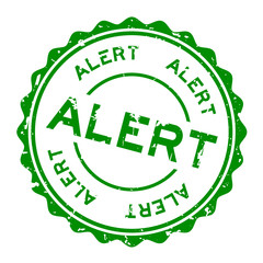 Grunge green alert word round rubber seal stamp on white background