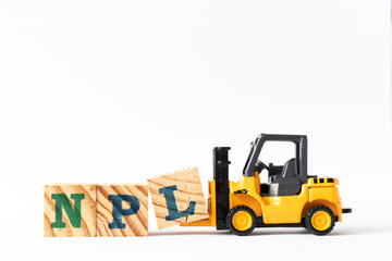 Toy forklift hold wood letter block L to complete word NPL (Abbbreviation of Non Performing Loan, Non-Patent Literature) on white background