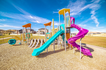 Colorful blue and purple slides in kids playground