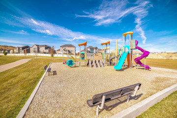 Small kids playground with colorful slides during day