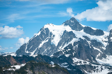 Snowcapped mountains landscape with blue sky and clouds, Mt Shuksan, Washington, USA