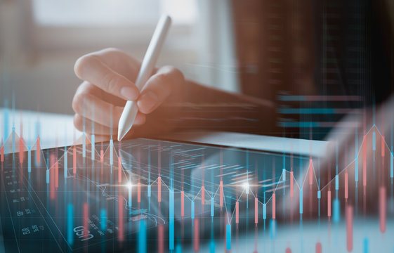 Stock Exchange Market Concept, Businessman Trader Looking On Tablet With Graphs Analysis Candle Line In Office Room, Diagrams On Screen.