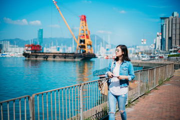 Fototapeta na wymiar Girl traveling in Hong Kong Causeway Bay waterfront.