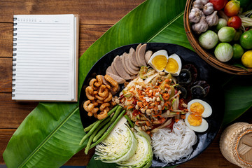 Som Tam Thai -Ingredients Papaya Salad Thai Food Style on wooden table background. Thai Food Concept. Top View