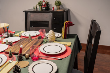Empty dining room is decorated with Christmas tree and gift presents for Christmas Day at night festival coming soon as background