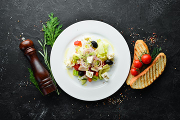 Greek salad. Feta cheese salad with olives. Top view. Free space for your text.