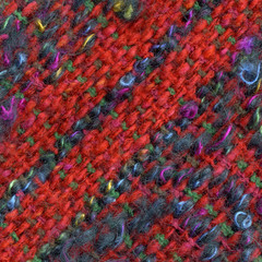 Close-up detail of handwoven woolen multi colored fabric