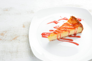 Cheesecake with strawberry sauce. Top view. Free space for your text.