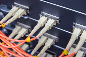 cable network , fiber optic cable connect to switch port in server room , Concept network management