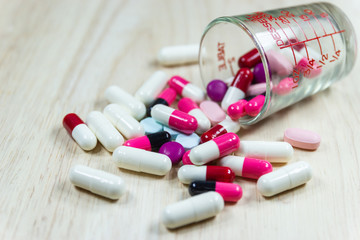 close up the capsules on wood table