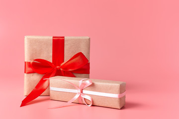 Wrapped presents on a pink background with copy space.