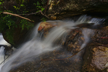 Streaming water of creek captured in long exposure